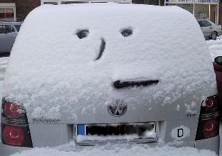 Face in Snow on Car